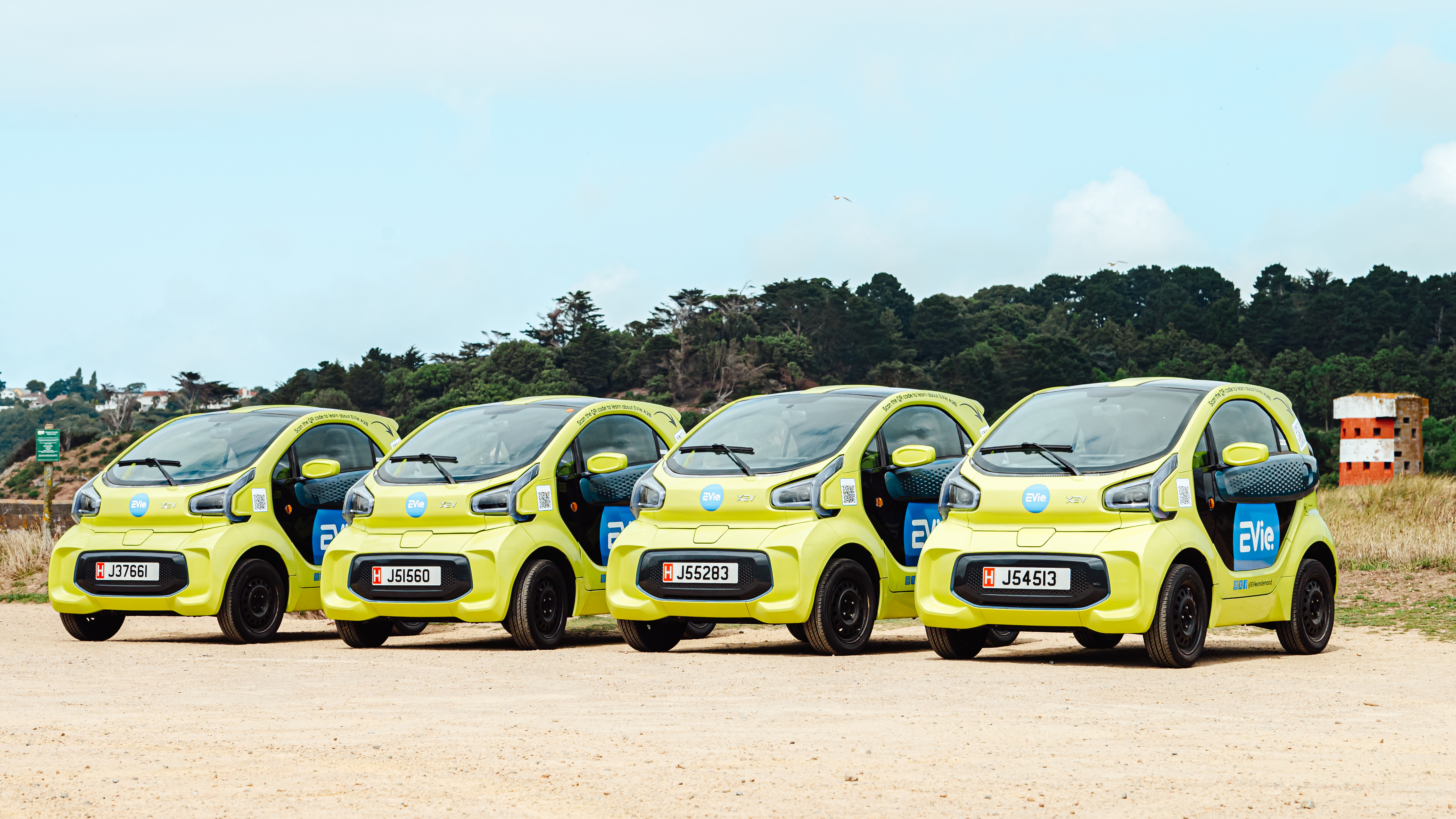 image of EVie green cars parked in a row